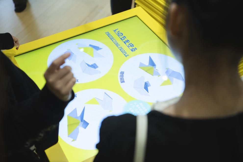 Visitors testing features of the EU Pavilion